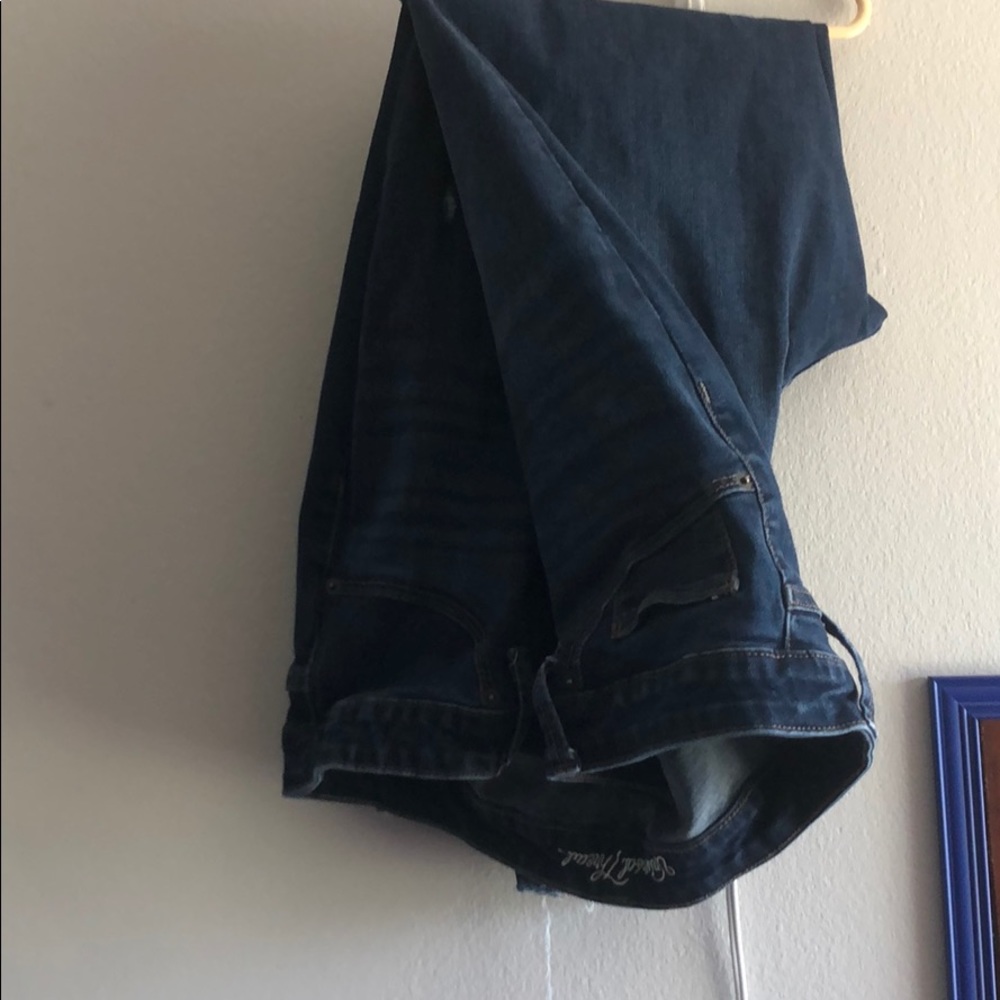 Universals thread dark wash jeans